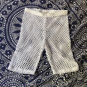 White fishnet bike shorts.